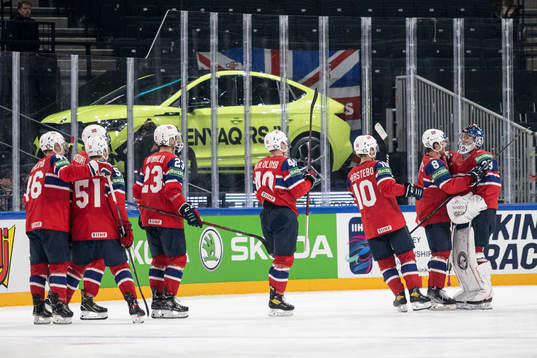 Goaltender Henrik Haukeland of Norway celebrate with