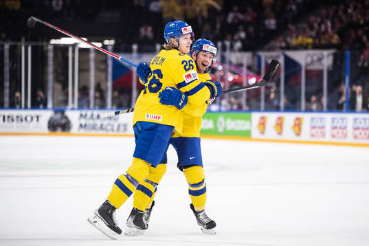 Rasmus Dahlin and Rasmus Asplund of Sweden celebrate