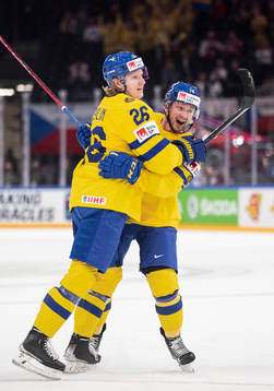 Rasmus Dahlin and Rasmus Asplund of Sweden celebrates