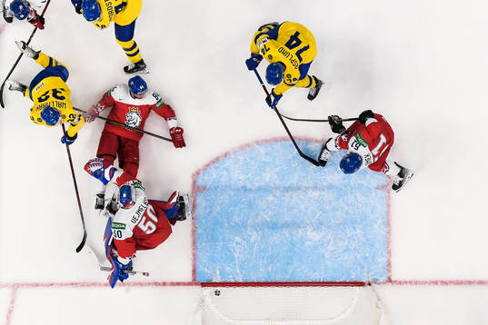 Rasmus Asplund of Sweden scores 1-1 behind goaltender Karel