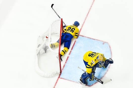 goaltender Magnus Hellberg of Sweden and Rasmus Dahlin of