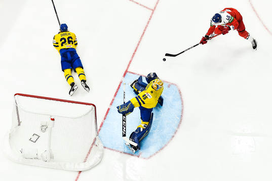 goaltender Magnus Hellberg of Sweden and Rasmus Dahlin of