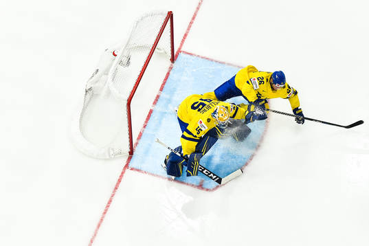 goaltender Magnus Hellberg of Sweden and Rasmus Dahlin of