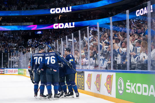 Mikael Granlund of Finland celebrate with teammates