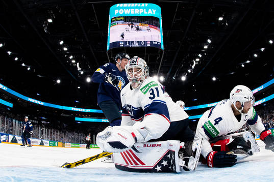 Goaltender Strauss Mann and Seth Jones of USA