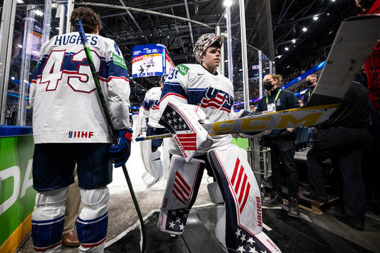Goaltender Strauss Mann of USA looks dejected