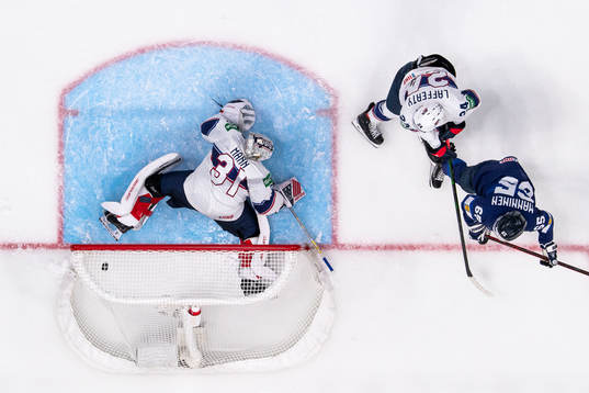 Saku Mäenalanen of Finland scores the 3-0 goal behind