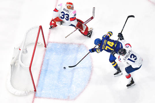 Rasmus Asplund of Sweden scores the 5-0 goal behind