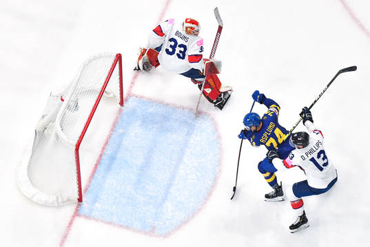 Rasmus Asplund of Sweden scores the 5-0 goal behind