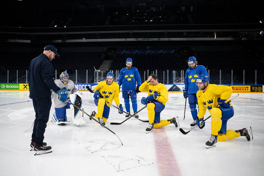 Goaltender coach Stefan Ladhe and players of Sweden at a