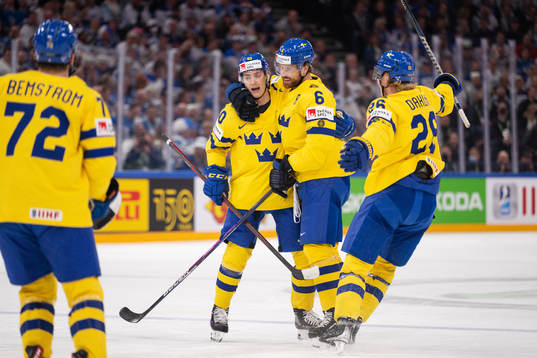 Jacob Peterson and Adam Larsson of Sweden celebrate the 0-1