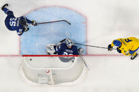 Adam Larsson of Sweden scores the 0-1 goal behind
