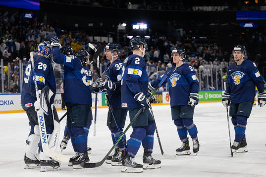 Players of Finland look dejected afterthe 2022 IIHF Ice