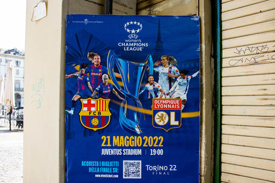 A poster with players of Barcelona and Lyon