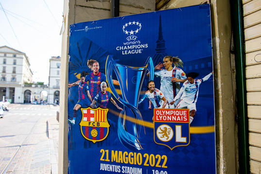 A poster with players of Barcelona and Lyon