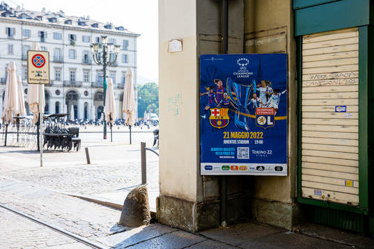 A poster with players of Barcelona and Lyon