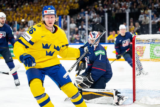 Rasmus Dahlin of Sweden scores 0-1 behind goaltender Jeremy