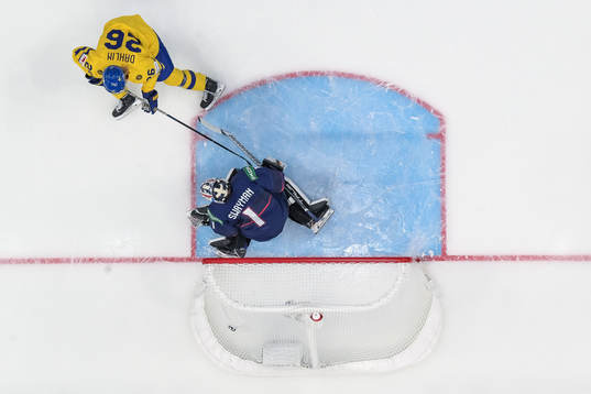 Rasmus Dahlin of Sweden scores 0-1 behind goaltender Jeremy