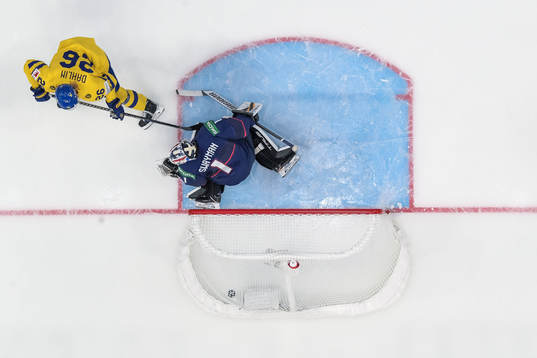 Rasmus Dahlin of Sweden scores 0-1 behind goaltender Jeremy