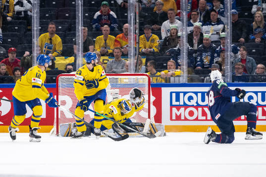 Nate Schmidt of USA scores 2-1 behind goaltender Linus