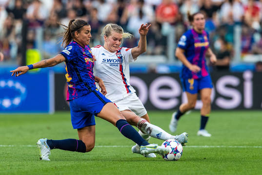 Patri Guijarro of Barcelona and Ada Hegerberg of Lyon