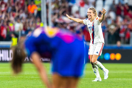 Ada Hegerberg of Lyon celebrates winning the UEFA Women's