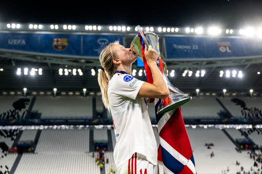 Ada Hegerberg of Lyon celebrates winning the UEFA Women's