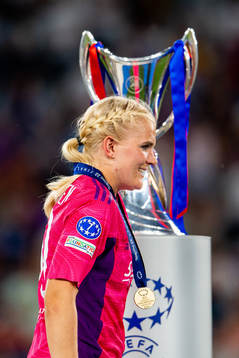 Goalkeeper Emma Holmgren of Lyon walks past the winners