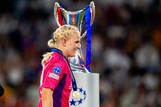 Goalkeeper Emma Holmgren of Lyon walks past the winners