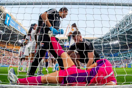 Goalkeeper Claudia Endler of Lyon receives medical treatment