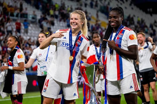 Ada Hegerberg and Griedge Mbock Bathy of Lyon celebrate