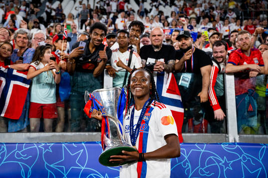 Melvine Malard of Lyon celebrates with the winners trophy