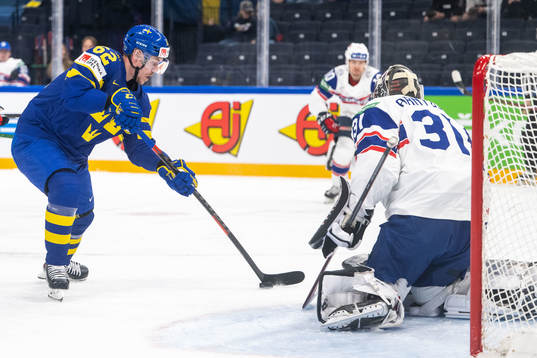 Joel Kellman of Sweden and goaltender Jonas Arntzen of