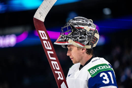 Goaltender Jonas Arntzen of Norway looks dejected