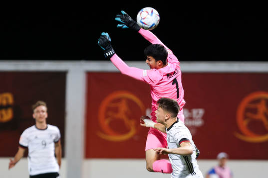 Dzenan Pejcinovic of Germany and goalkeeper Ofek Melika of