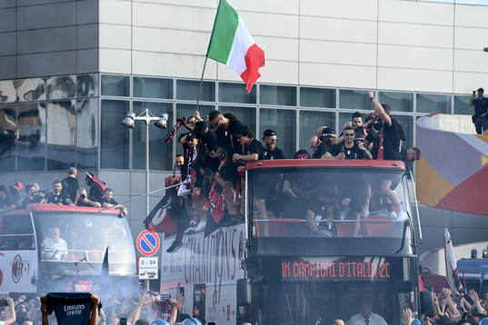 Players of Milan celebrate