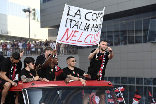 Players of Milan celebrate