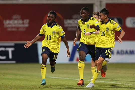 Jardell Kanga of Sweden celebrates with Emmanuel Tannor and