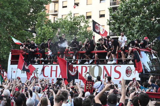 Players of Milan celebrate