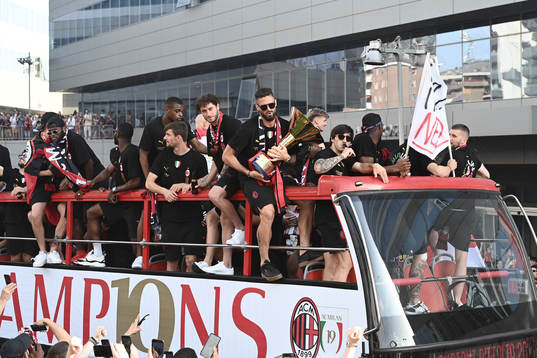 Players of Milan celebrate