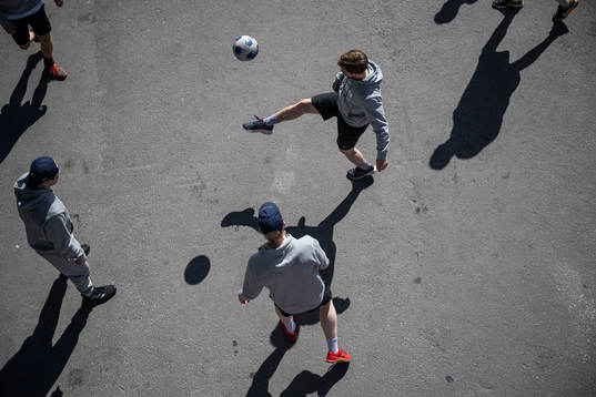 Oskar Lang of Sweden play football with teammates