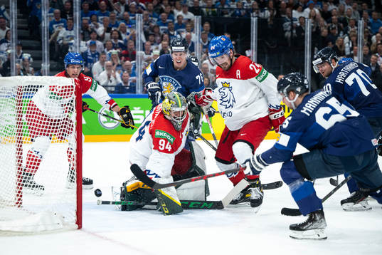 Sakari Manninen of Finland scores the 2-0 goal behind