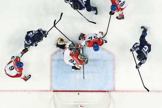 Sakari Manninen of Finland scores the 2-0 goal behind