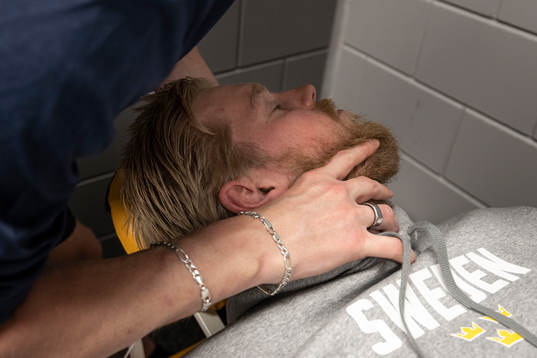 Goaltender Magnus Hellberg of Sweden gets a massage