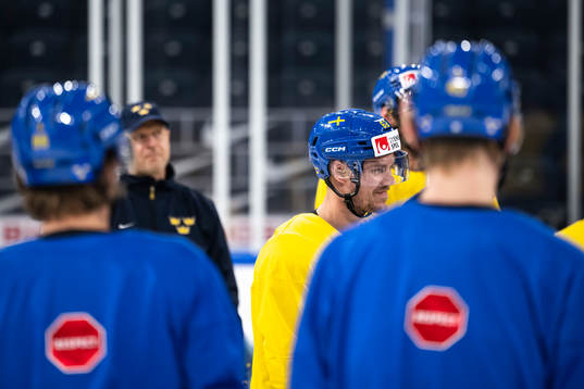 Joel Kellman of Sweden with teammates at a practice session