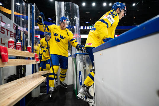 Carl Grundström and Lucas Wallmark of Sweden enter the ice