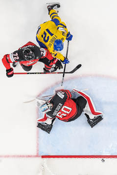 goaltender Chris Driedger and Thomas Chabot of Canada as