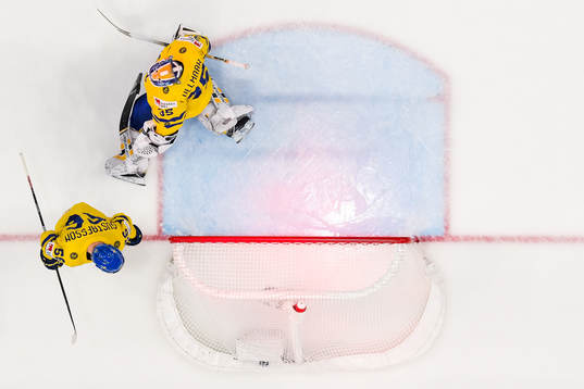 Erik Gustafsson and goaltender Linus Ullmark of Sweden look