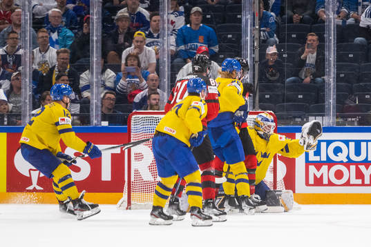 goaltender Linus Ullmark of Sweden saves a shot