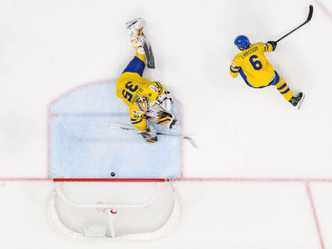 goaltender Linus Ullmark of Sweden looks dejected
